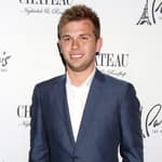 Chase Chrisley posing on the red carpet.
