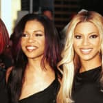 Destiny's Child posing in all black for a group photo in 2001.