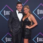 Brittany Cartwright and Jax Taylor posing together on the red carpet.