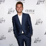 Chase Chrisley posing on the red carpet.