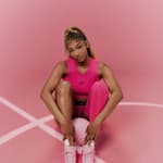 Angel Reese posing in her signature shoe.