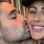 Alan Bersten kisses Emma Slater on the cheek