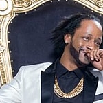 A photo showing Katt Williams sitting on a golden chair.