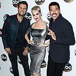 Luke Bryan, Katy Perry, and Lionel Richie pose on red carpet