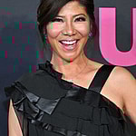 Julie Chen posing on the red carpet.