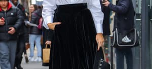 Blake Lively is all smilies while posing in a black and white outfit in NYC