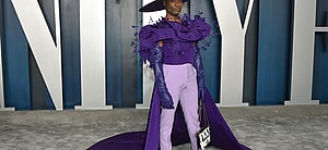 Billy Porter wearing massive purple hat
