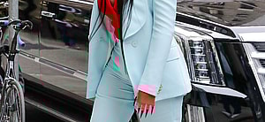 Cardi B looks looks radiant in a light blue suit as arriving at an office building in NYC
