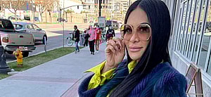 Jen Shah posing on sidewalk