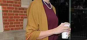 Taylor Swift leaving The Hospital Club in Covent Garden The singer was wearing polkadot jeans a maroon sweater with a yellow cardigan over the top She also wore sunglasses a pearl necklace and a burnt orange Mark Cross Scottie Satchel