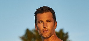 Tom Brady shows off his abs as he poses in new swimwear line