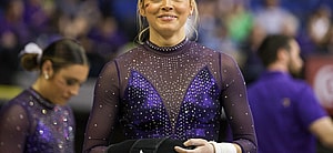 March 8, 2024: LSU's Olivia Dunne smiles to a fan during the Purple and Gold Podium Challenge woman's gymnastics quad meet at the Raising Canes River Center in Baton Rouge, LA. Jonathan Mailhes/CSM (Credit Image: © Jonathan Mailhes/Cal Sport Media) Newscom/(Mega Agency TagID: csmphotothree239106.jpg) [Photo via Mega Agency]