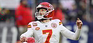 Harrison Butker kicking the football