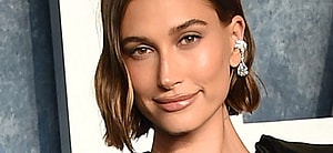 Hailey Bieber smiling at an event