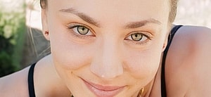 Kaley Cuoco smiles close up