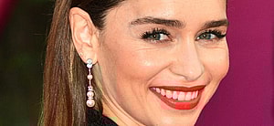 Emilia Clarke poses smiling