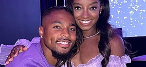 Jonathan Owens and Simone Biles matching in purple outfits