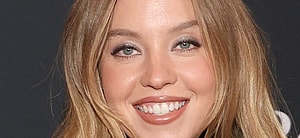 Sydney Sweeney smiling close up