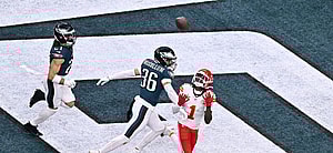 Xavier Worthy catching a football during an NFL game.