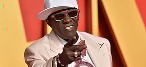 Flavor Flav posing on the red carpet.