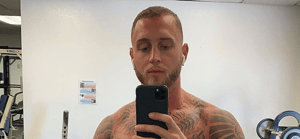 Chet Hanks flexing at the gym