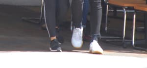 Shawn Mendes with arm around Camila Cabello