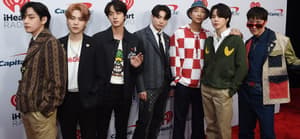 BTS members posing for the camera.