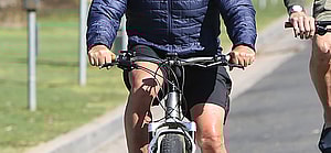 Arnold Schwarzenegger biking in Venice Beach after leaving GoldS Gym