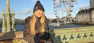 A photo showing Sarah Roemer sporting a black puffy coat.