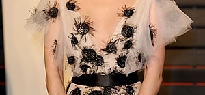 Emma Roberts poses on the red carpet at the Vanity Fair Oscar Party in LA