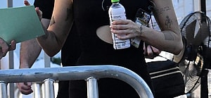 Miley Cyrus wears a black cutout romper and sips a coconut water as she heads to rehearsal for her New Year apos s Eve show in Miami