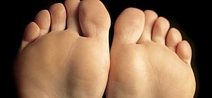 Shallow depth-of-field image of the bottom of a females feet.