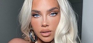 Olivia Pierson in halter top and skirt