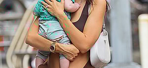 Emily Ratajkowski is all smiling while carrying her Baby as they taking a stroll with husband Sebastian Bear-McClard in NYC