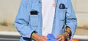 Jay Leno stops by a gas station in yet another cool car after getting out of the hospital yesterday