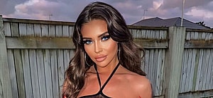 Larissa Trownson poses in a see-through dress