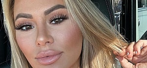 Kindly Myers sitting in traffic