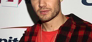 Liam Payne wearing a red shirt
