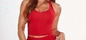 Khloé Kardashian posing for Fabletics.