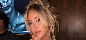 Brittany Mahomes at a table