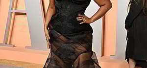 Lizzo posing on the red carpet.