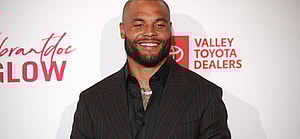 Dak Prescott posing on the red carpet.