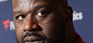 Shaq posing for a picture.