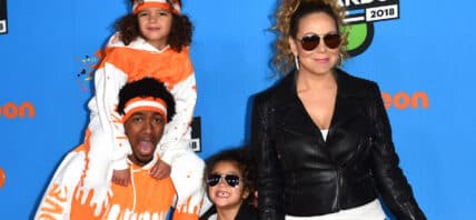 Nick Cannon posing with his ex-wife and his children.