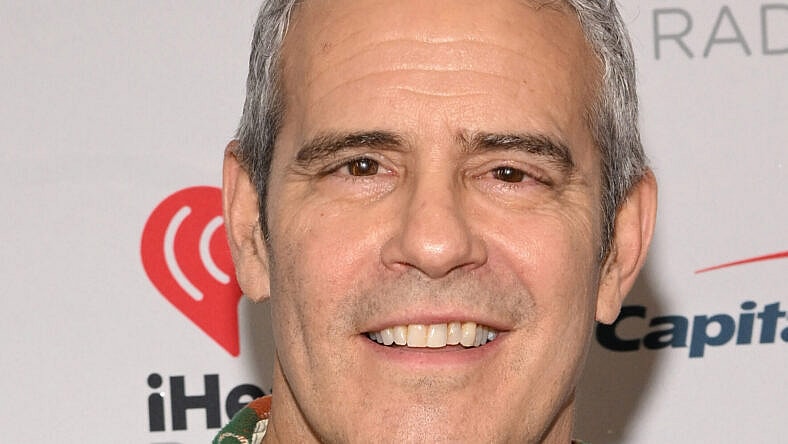 Andy Cohen posing on the red carpet.