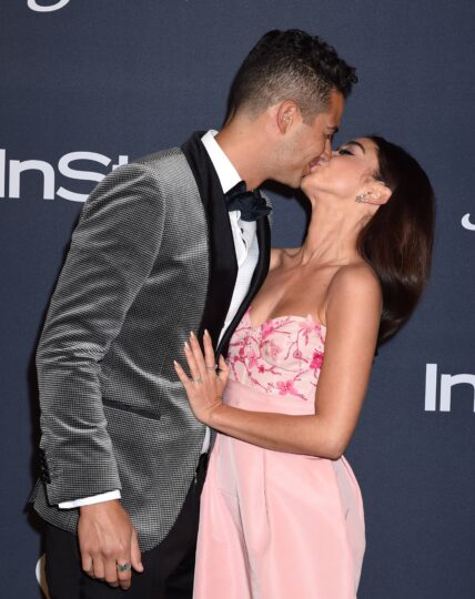 Sarah Hyland and Wells Adams kissing