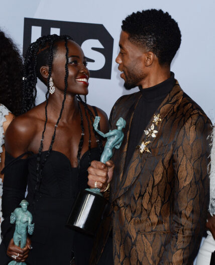 Lupita Nyong’o and Chadwick Boseman smiling