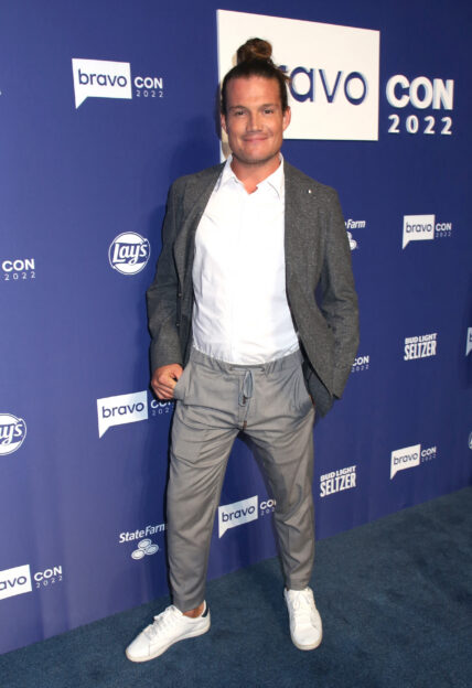 Gary King from "Below Deck" posing on the red carpet during a Bravo event.