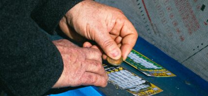 A man scratching a lottery ticket