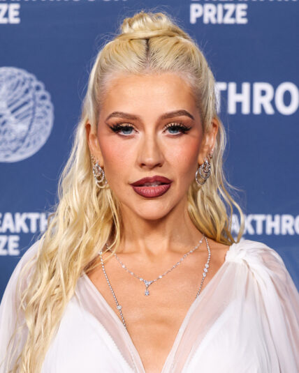 Christina Aguilera wearing Dolce and Gabbana with David Yurman earrings arrives at the 11th Annual Breakthrough Prize Ceremony 2025